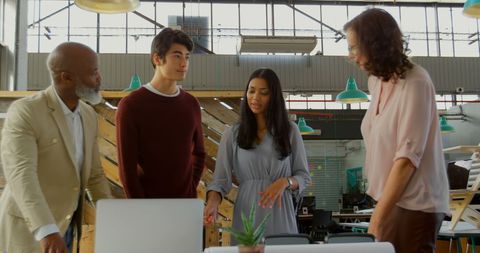 Diverse Team Collaborating in Modern Office on Innovative Project