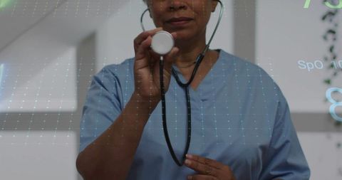 Healthcare professional using stethoscope with vital signs overlay