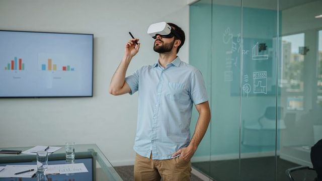 Professional Using VR Headset in Modern Meeting Room