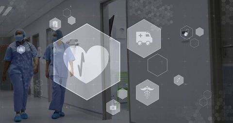 Nurses walking down hospital corridor with digital medical icons overlay