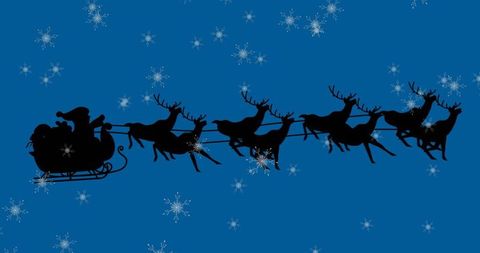 Silhouette of Santa Sleigh and Reindeer in Snowy Night Sky