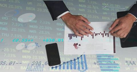 Businessman Analyzing Financial Data with Graphs