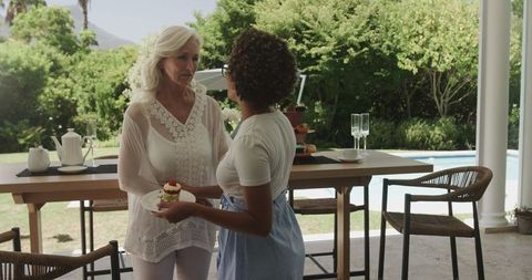 Setting up outdoor table for elegant wedding reception