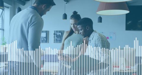 Diverse Team Working on Business Report with Digital Visualization