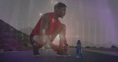 African American Athlete Tying Shoes with Digital Network Overlay