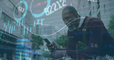 man engaged with smartphone amid digital finance graph overlay - Download Free Stock Images Pikwizard.com