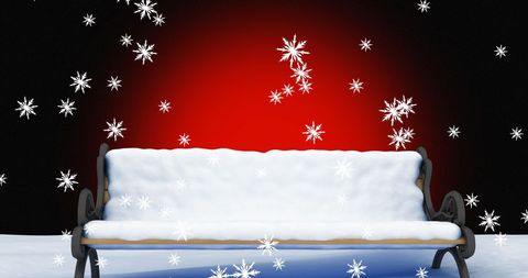 Snow Covered Bench with Falling Snowflakes and Red Background