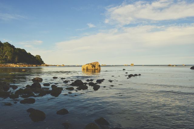 Coastal Landscape with Rocky Shore Under Clear Sky - Download Free Stock Photos Pikwizard.com