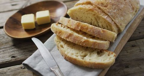 Sliced homemade bread on rustic wooden table