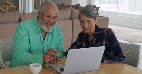 Senior Couple Engaging with Technology in Home Setting