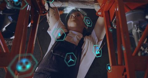 Technician working on pipes with digital interface