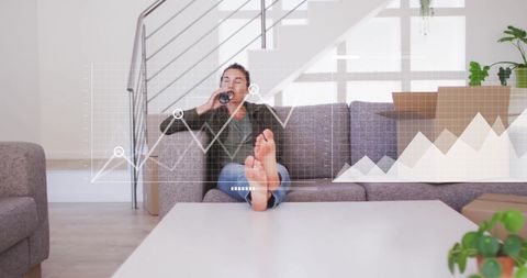 Woman Relaxing While Analyzing Financial Data Graphs in Modern Home