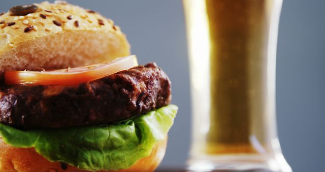 Close-up of Juicy Hamburger and Beer - Download Free Stock Images Pikwizard.com