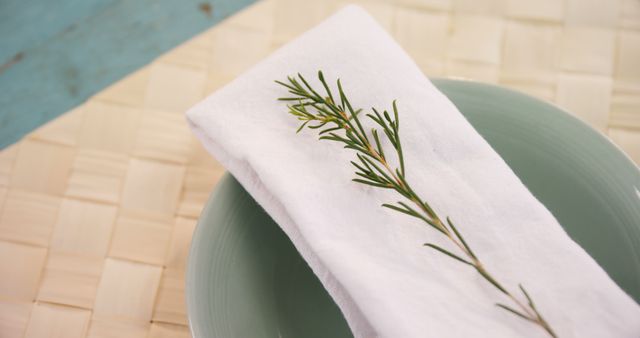 Elegant Table Setting with Rosemary Adorned Napkin and Clean Plates - Download Free Stock Images Pikwizard.com