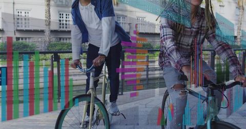Urban cyclists riding waterfront with data visualization overlays for mobility insights