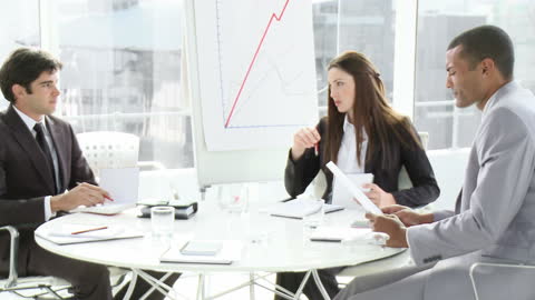Diverse Business Team Collaborating in Meeting Room