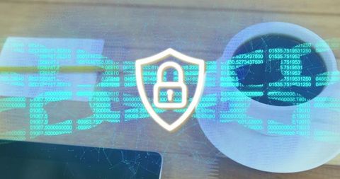 Holographic cybersecurity shield lock hovering over desk with coffee and floating code