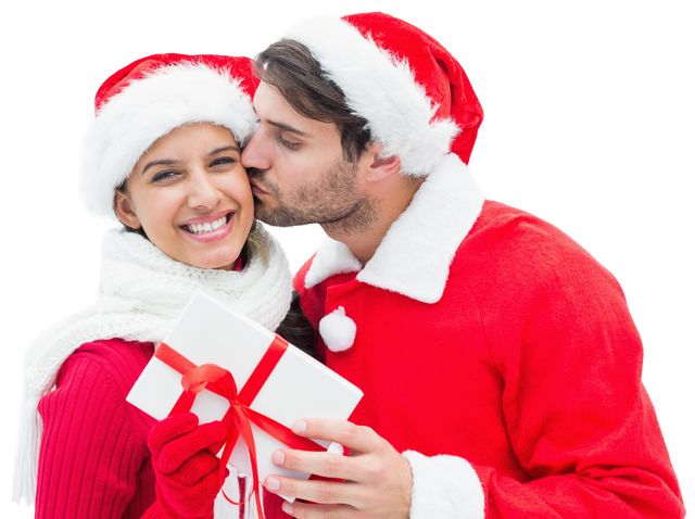 Cheerful Couple in Santa Hats Sharing Christmas Gift Transparent - Download Free Stock Videos Pikwizard.com