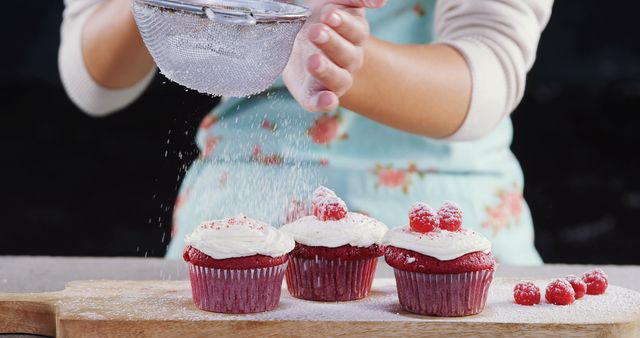 Baking Delicacies: Red Velvet Cupcakes with Raspberries and Icing Sugar - Download Free Stock Images Pikwizard.com