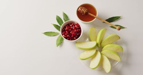 Fresh Honey, Pomegranate Seeds, and Sliced Apples on Table - Download Free Stock Images Pikwizard.com