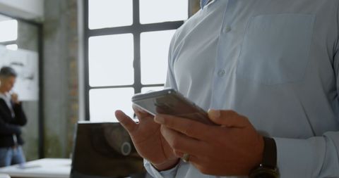 Businessman Engaging with Smartphone for Digital Communication - Download Free Stock Images Pikwizard.com