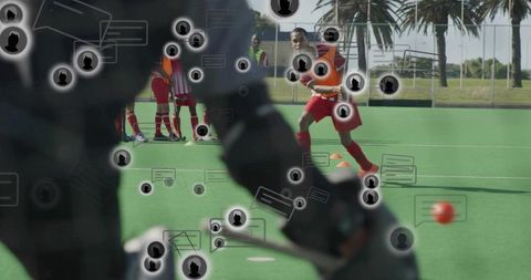 Goalkeeper blocking shot during field hockey training with social media chat overlay