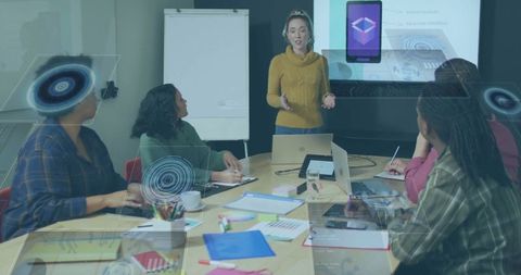 Businesswoman Leading Presentation in Modern Office Meeting About Technology