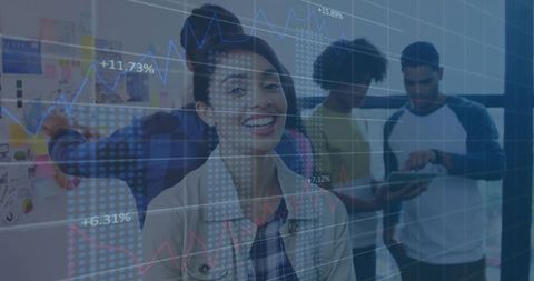 Smiling Businesswoman Leading Diverse Team in Data Analysis