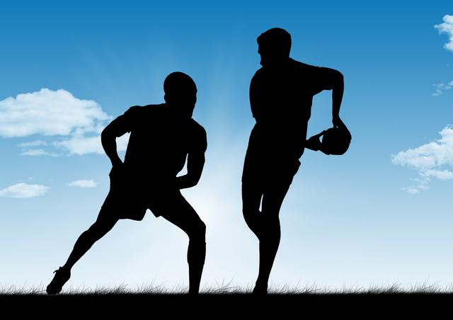 Silhouetted rugby players competing under a clear blue sky with clouds. Ideal for use in sports promotions, teamwork concepts, athletic event advertisements, and outdoor activity themes.