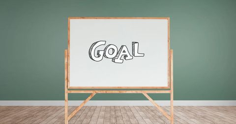 Goal concept on easel whiteboard in minimalist room