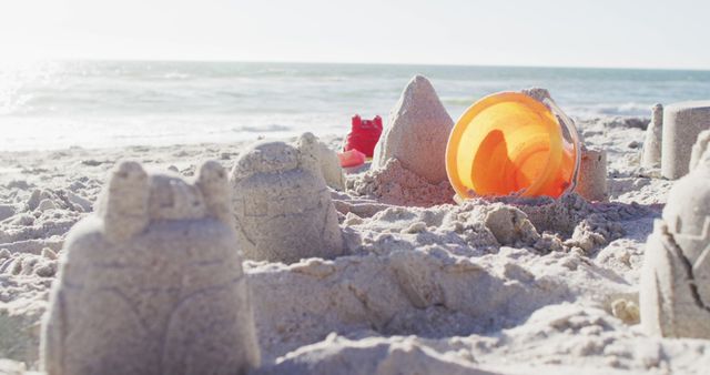 Image of plastic toys lying on sand on beach. Holidays, vacations, relax and summer concept.