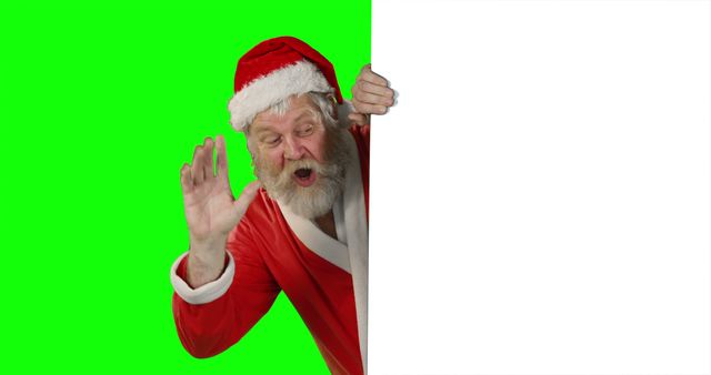 Santa Claus Peeking Around Corner with Solid Green Background - Download Free Stock Images Pikwizard.com