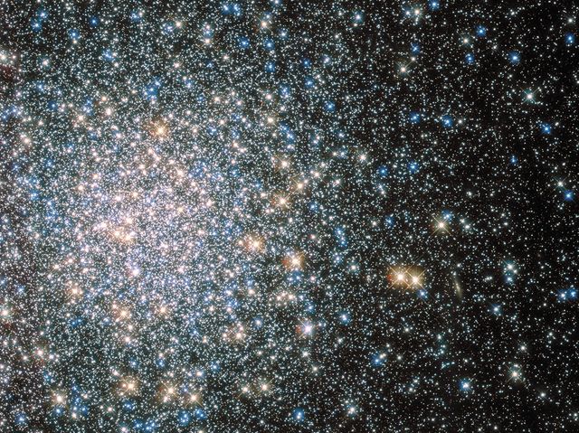 Image of Messier 5, a massive globular cluster with hundreds of thousands of stars. Displays young blue stragglers and old red giants. Perfect for use in astronomy publications, space research, educational materials, and science articles focusing on deep space, star clusters, or astrophysical phenomena. Highlights NASA and ESA missions studying such celestial bodies.