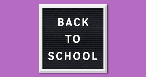 Back to School Sign on Purple Background