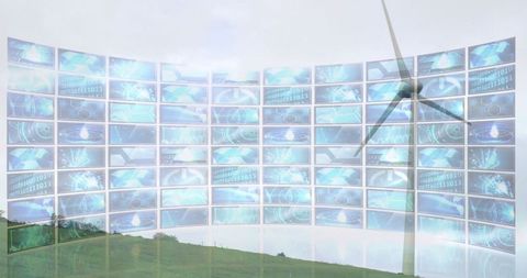 Wind turbine with digital data screens over green hill in futuristic sectpieeting