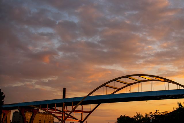 Dramatic Sunset Skies Over Arched Bridge - Download Free Stock Photos Pikwizard.com