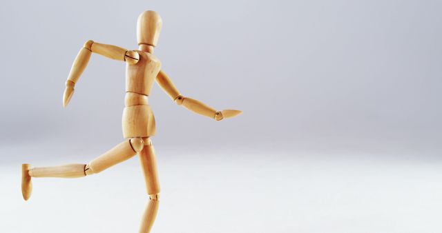 Wooden Art Mannequin Running on White Background - Download Free Stock Images Pikwizard.com