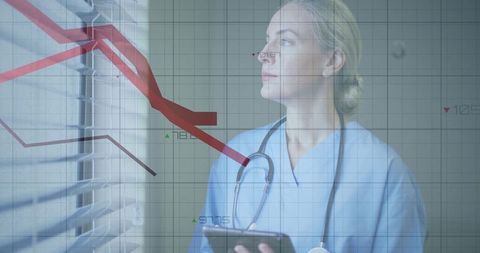 Healthcare professional analyzing digital data trend lines