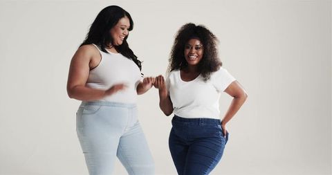 Diverse Female Friends Linking Pinky Fingers Smiling