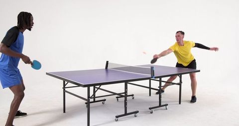 Energetic Ping Pong Game Between Competitive Male Players