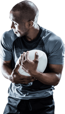 Focused rugby player holding ball transparent background
