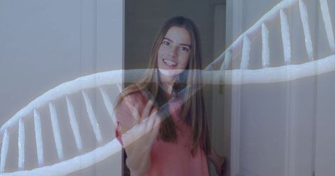 Smiling young woman standing in doorway with dna helix overlay representing genetic testing