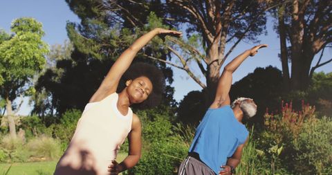 Mature Couple Enjoying Morning Stretching in the Park