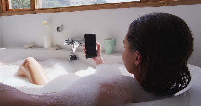 Woman Relaxing in Bubble Bath While Using Smartphone - Download Free Stock Images Pikwizard.com