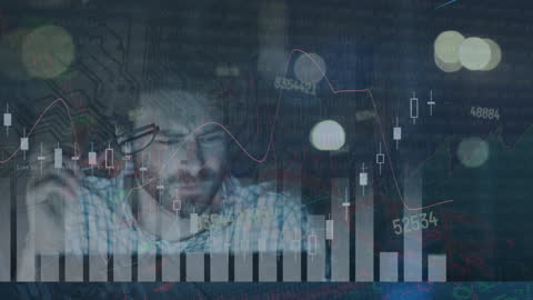 Businessman Analyzing Data with Digital Graphs Overlay