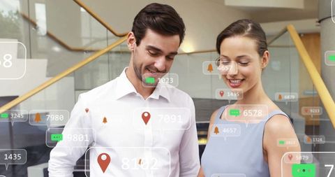 Colleagues Engaging with Dynamic Digital Interface in Modern Office