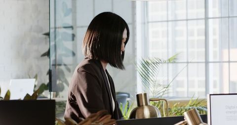 Woman discussing digital strategies in modern office