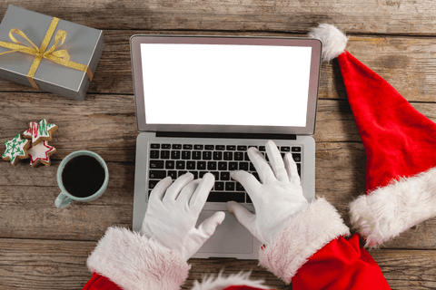 Santa Claus Typing on Laptop with Transparent Screen by Coffee and Cookies - Download Free Stock Videos Pikwizard.com