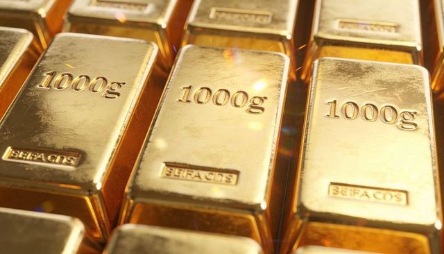 Stacked 1000g gold bars reflecting light showing assay marks for bullion reserve