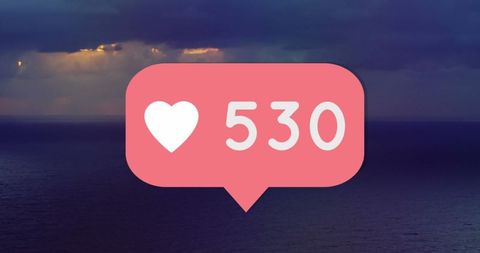 Social Media Engagement Icon Over Ocean Sunset